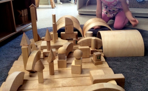 child's city constructed with wooden blocks
