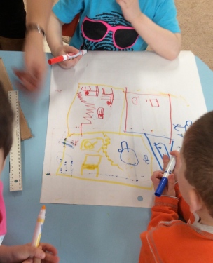 children drawing a model building