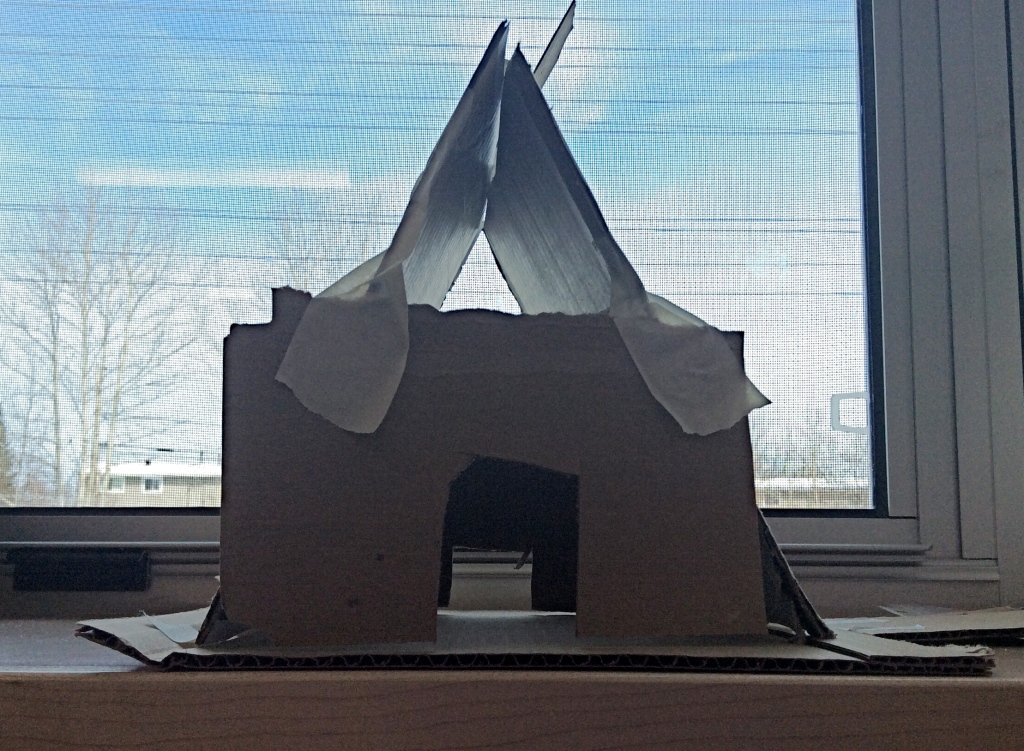 a-frame house built with cardboard