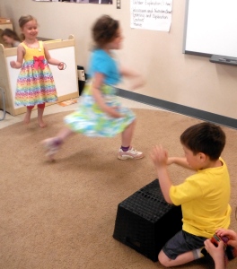 children dancing with drum accompaniment